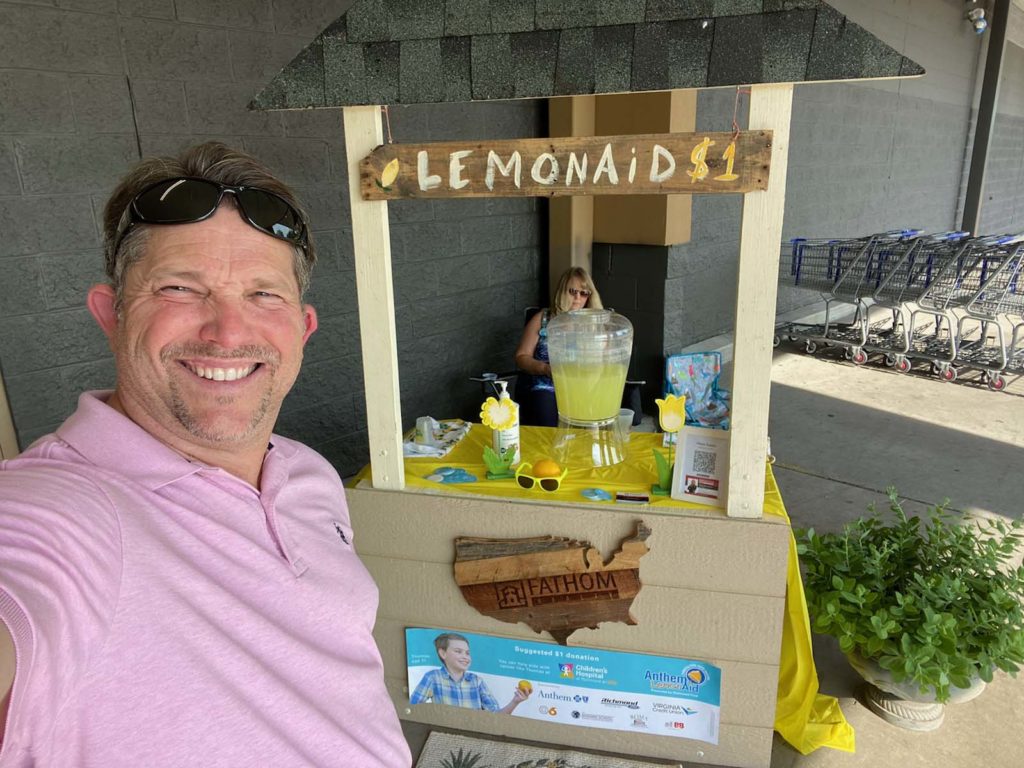 Realty Agents raising charity funds by selling lemonade
