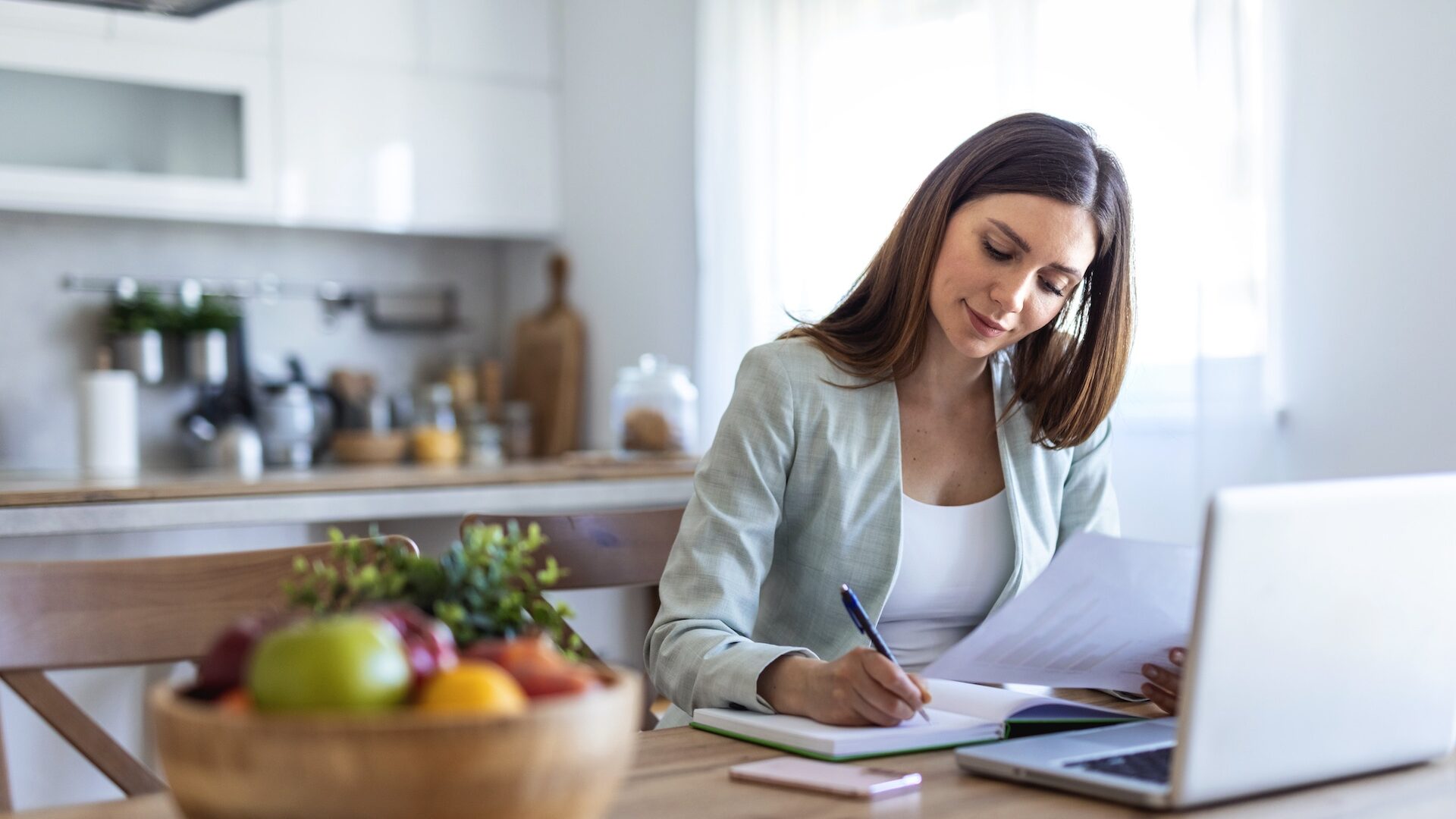 Laptop, writing and research with business woman in office for real estate brokerage, property listing and planning.